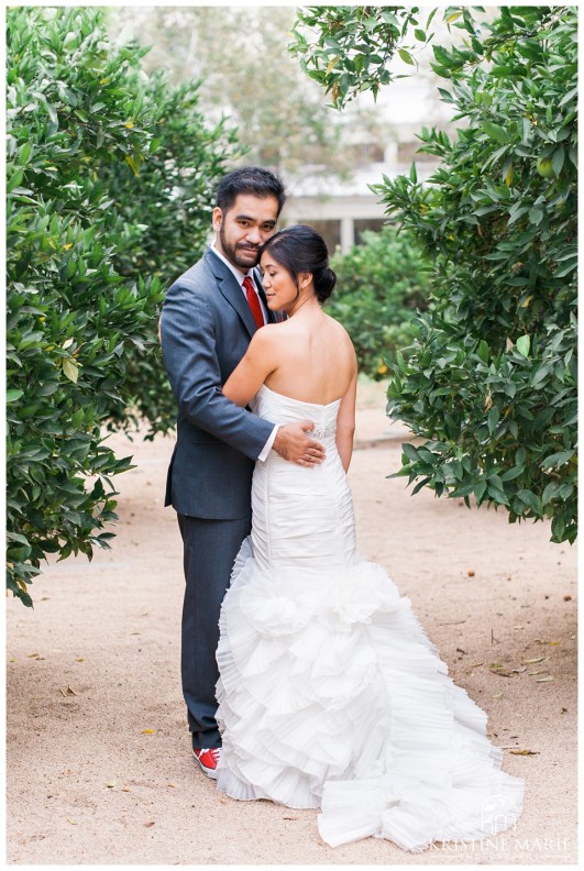 Bride and Groom Pose in Orange Grove | California Center for the Arts Escondido Wedding Photo | © Kristine Marie Photography