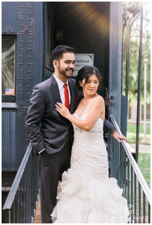 Bride and Groom On Train Photo | California Center for the Arts Escondido Wedding Photo | © Kristine Marie Photography