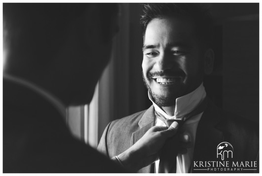 Groom Putting on Tie | California Center for the Arts Escondido Wedding Photo | © Kristine Marie Photography
