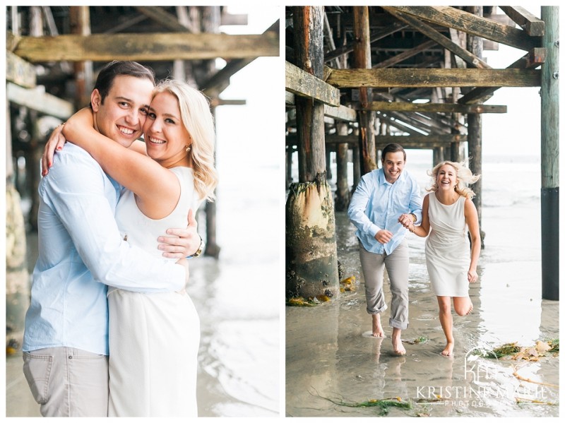 Happy Couple Running Together under Crystal Pier  Pacific Beach San Diego Engagement Photographer | Kristine Marie Photography | © www.kristinemariephotography.com