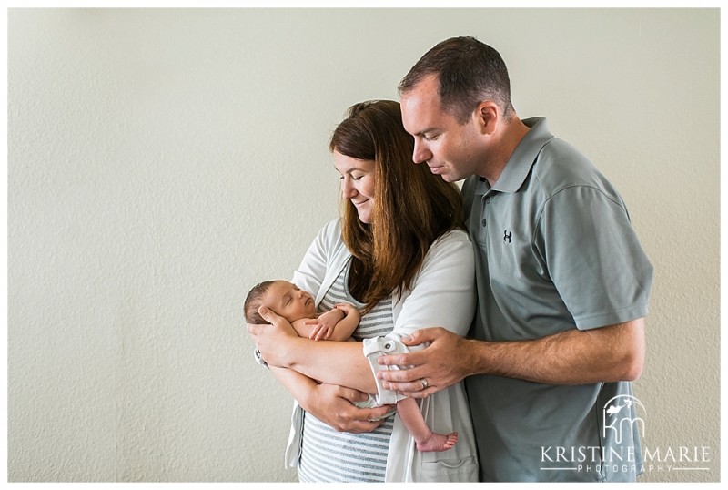 Mom and Dad Holding Their Newborn Baby Portrait | | San Diego Newborn Baby Photographer | Kristine Marie Photography © www.kristinemariephotography.com