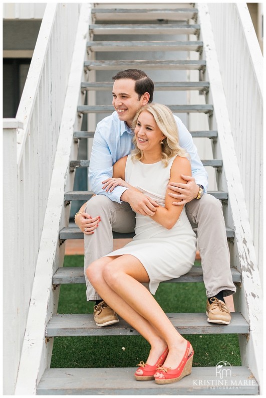 Happy Couple Sitting on Beach Stairs | Pacific Beach San Diego Engagement Photographer | Kristine Marie Photography | © www.kristinemariephotography.com 