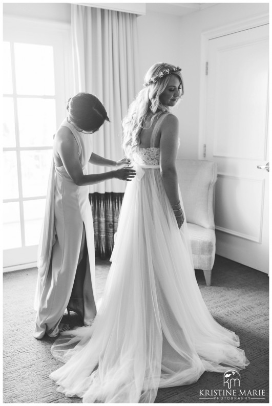 Maid of Honor Helping Bride into BHLDN wedding dress | Park Hyatt Aviara Resort Wedding | Carlsbad Wedding Photographer | Kristine Marie Photography © www.kristinemariephotography.com