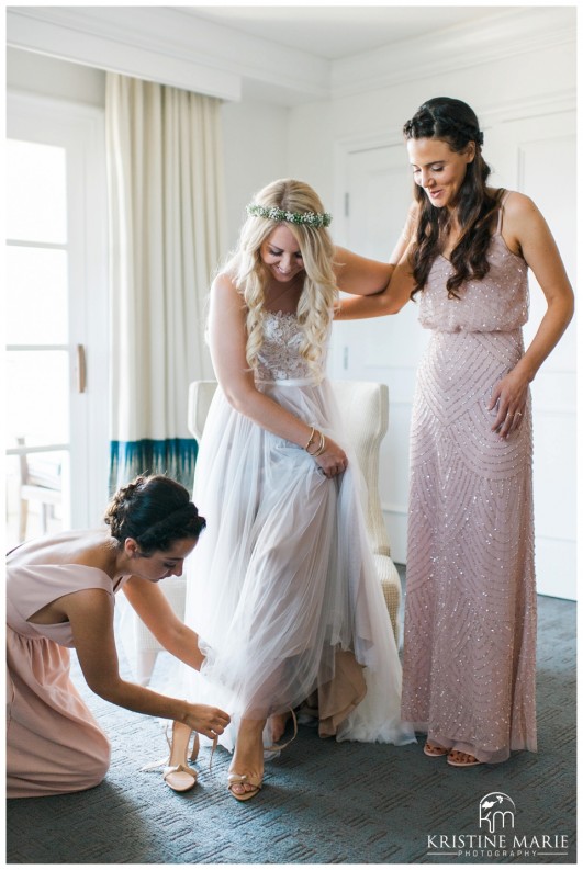 Bridesmaids in Adriana Papell Dress Help Bride Put on Wedding Shoes | Park Hyatt Aviara Resort Wedding | Carlsbad Wedding Photographer | Kristine Marie Photography © www.kristinemariephotography.com