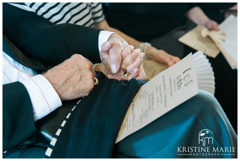 Guests Holding Hands | | Magee Park Heritage Hall Wedding Carlsbad San Diego Wedding Photographer | Kristine Marie Photography | © www.kristinemariephotography.com