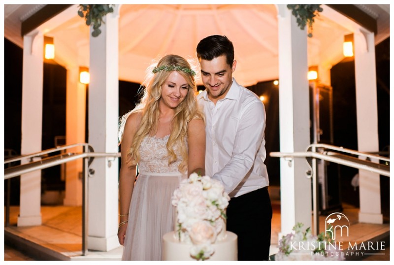 Bride and Groom cut the wedding cake | Dinner Table Decor | | Photo by Kristine Marie Photography | San Diego Wedding Photographer | Heritage Hall Magee Park Carlsbad Wedding | © www.kristinemariephotography.com