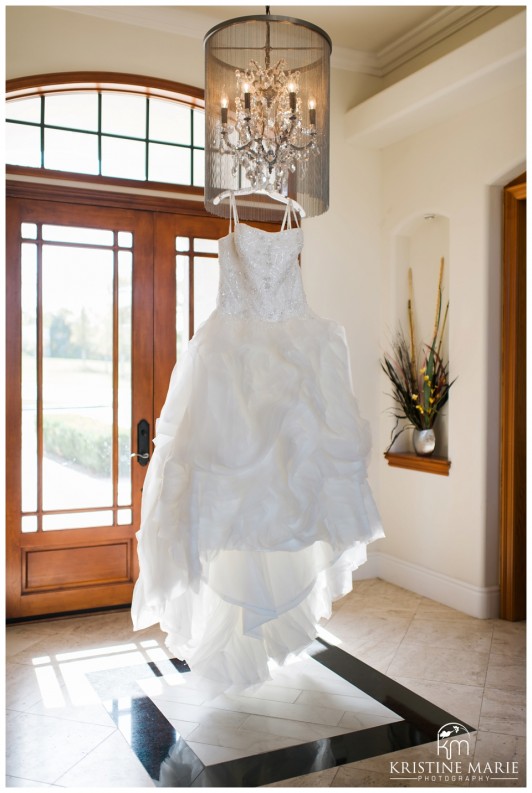 Wedding Dress Hanging On Chandelier | Maderas Golf Club Bridal Suite | Poway San Diego Wedding Photographer | Kristine Marie Photography | © www.kristinemariephotography.com