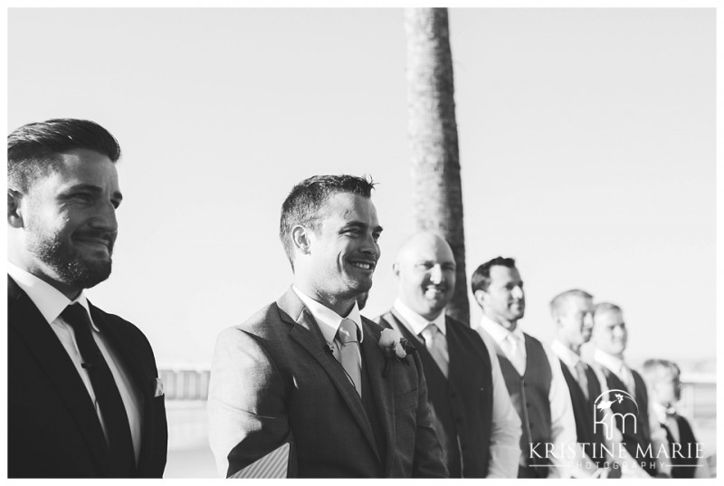 Groom sees his bride walking down the aisle Scripps Seaside Forum Wedding | La Jolla San Diego Wedding Photographer | Kristine Marie Photography | © www.kristinemariephotography.com