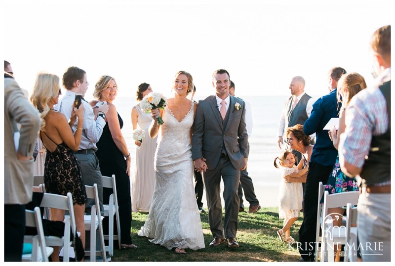 newlyweds walk down aisle | Scripps Seaside Forum Wedding | La Jolla San Diego Wedding Photographer | Kristine Marie Photography | © www.kristinemariephotography.com