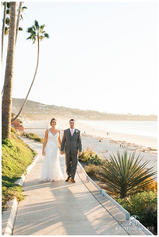 Palm trees bride and groom romantic photo | Scripps Seaside Forum Wedding | La Jolla San Diego Wedding Photographer | Kristine Marie Photography | © www.kristinemariephotography.com