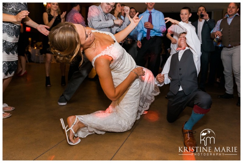 bride air guitar dance off | Scripps Seaside Forum Wedding | La Jolla San Diego Wedding Photographer | Kristine Marie Photography | © www.kristinemariephotography.com