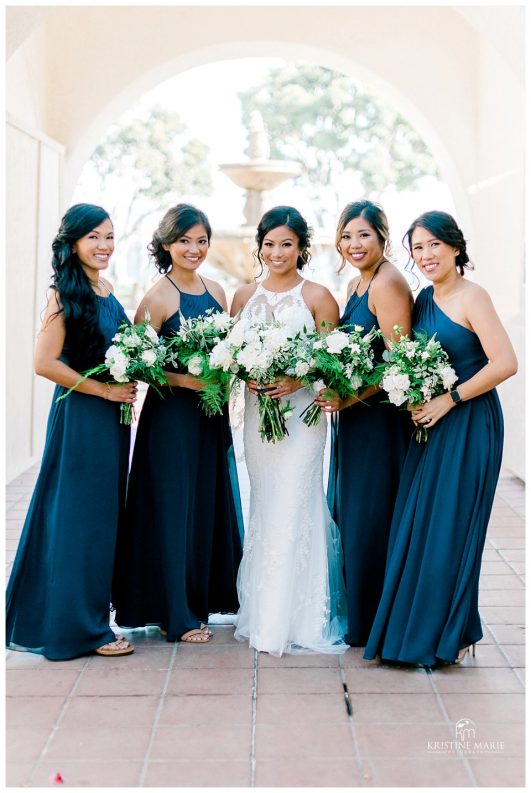 bridesmaids in long blue dress | Kona Kai Resort Wedding Picture San Diego Photographer | © Kristine Marie Photography 