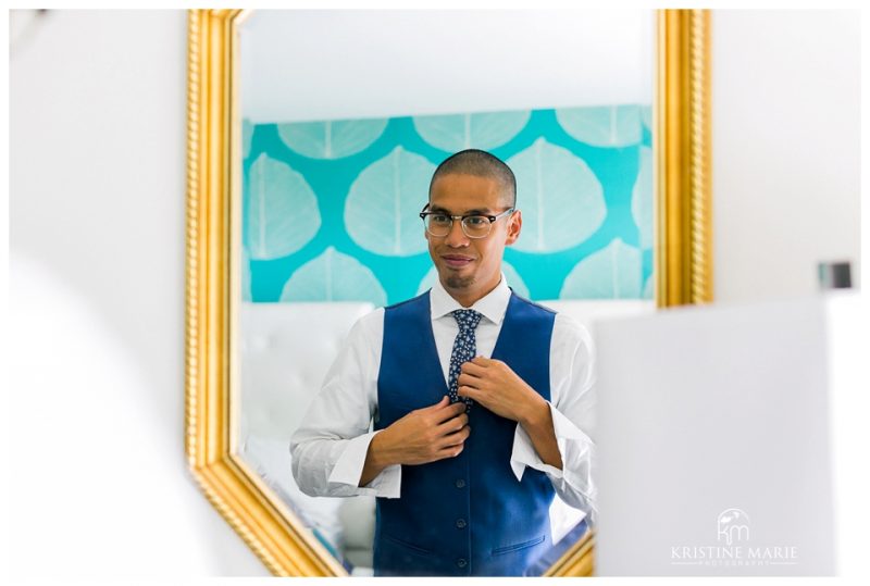 reflection of groom getting ready | Kona Kai Resort Wedding Picture | San Diego | © Kristine Marie Photography