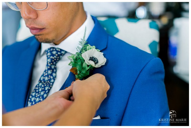 boutonniere pinned on groom | Kona Kai Resort Wedding Picture San Diego Photographer | © Kristine Marie Photography 